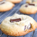 Chocolate chunks cookies on a cookie rack.