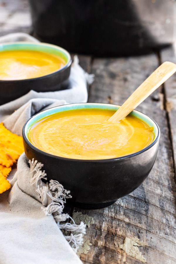 Curried Sweet Potato + Carrot Soup in bowls