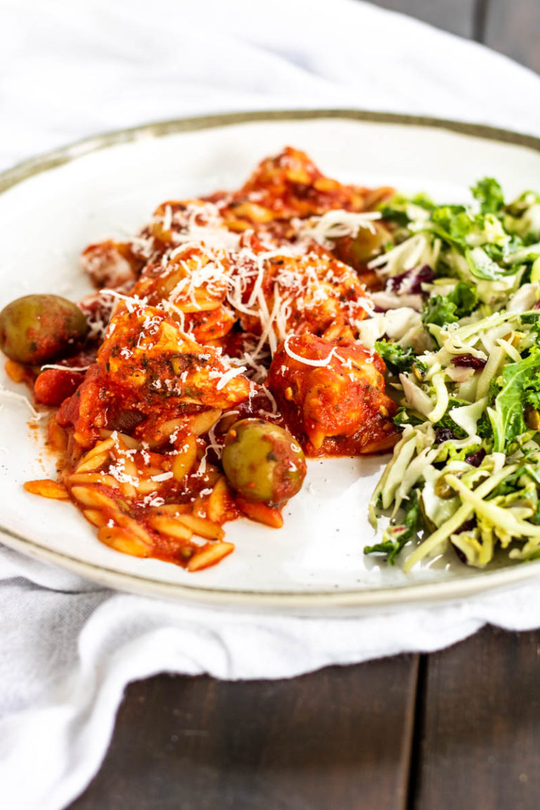 chicken in tomato sauce on a plate.