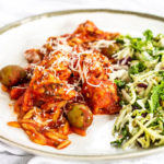 chicken in tomato sauce on a plate.