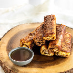 Peanut Butter Banana French Toast Roll-Ups on a wooden platter.