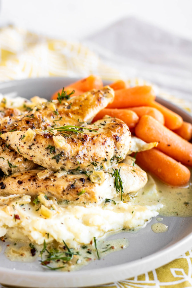 Creamy Dill Chicken on a plate with potatoes & carrots