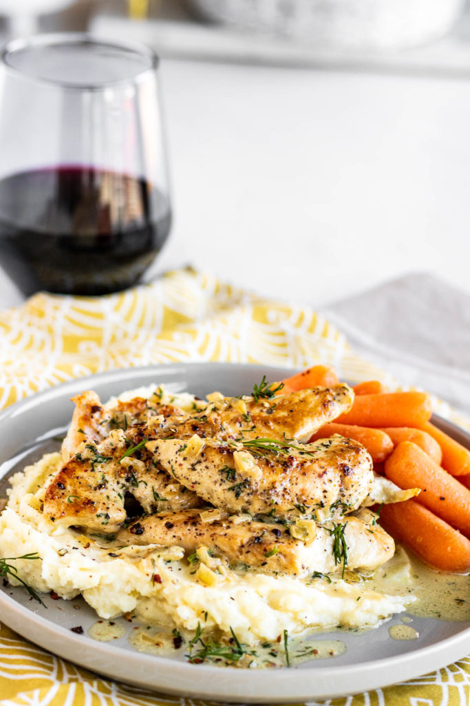 Creamy Dill Chicken on a plate with potatoes & carrots