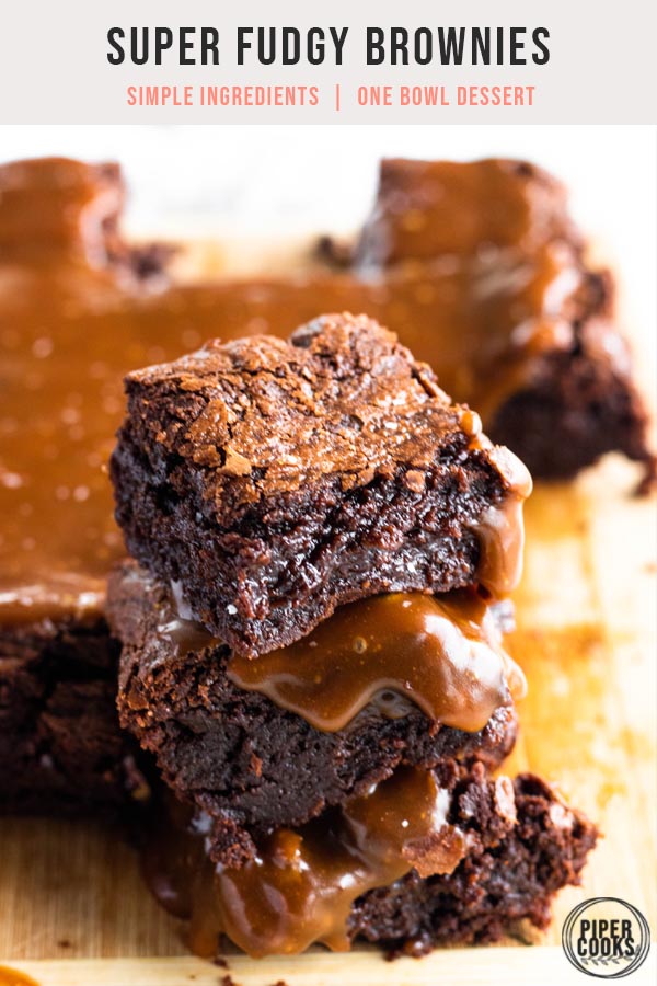 stack of three brownies with salted caramel sauce on top with text overlay for pinterest