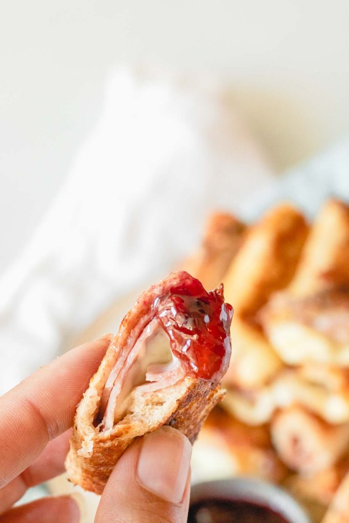 Monte Cristo Roll-Ups on a plate with jam