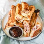 Monte Cristo Roll-Ups on a plate with jam