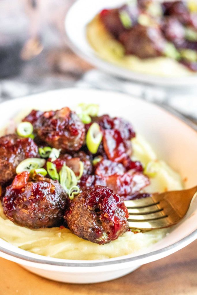 cranberry meatballs on potatoes in a bowl