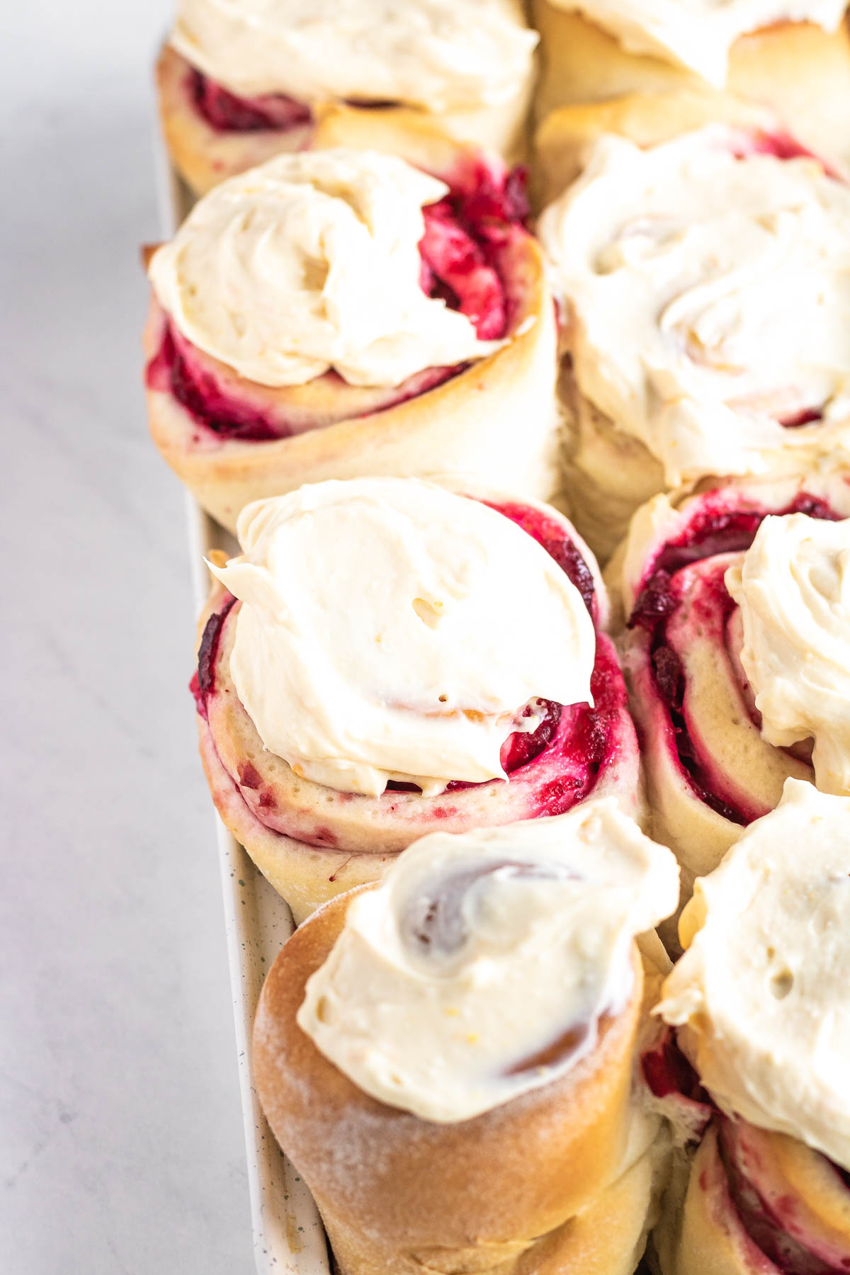 cranberry sweet rolls in a baking pan
