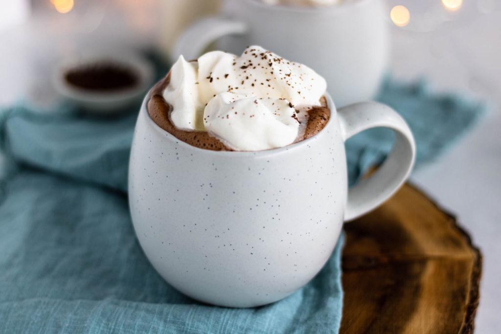 Peppermint Hot Chocolate in a mug with whipped cream on top