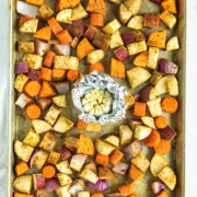cubed potatoes on a sheet pan with garlic