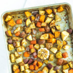 cubed potatoes on a sheet pan with garlic