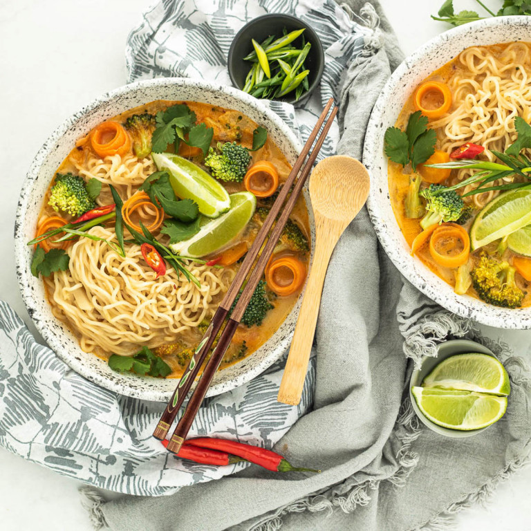 coconut curry ramen soup in bowls.