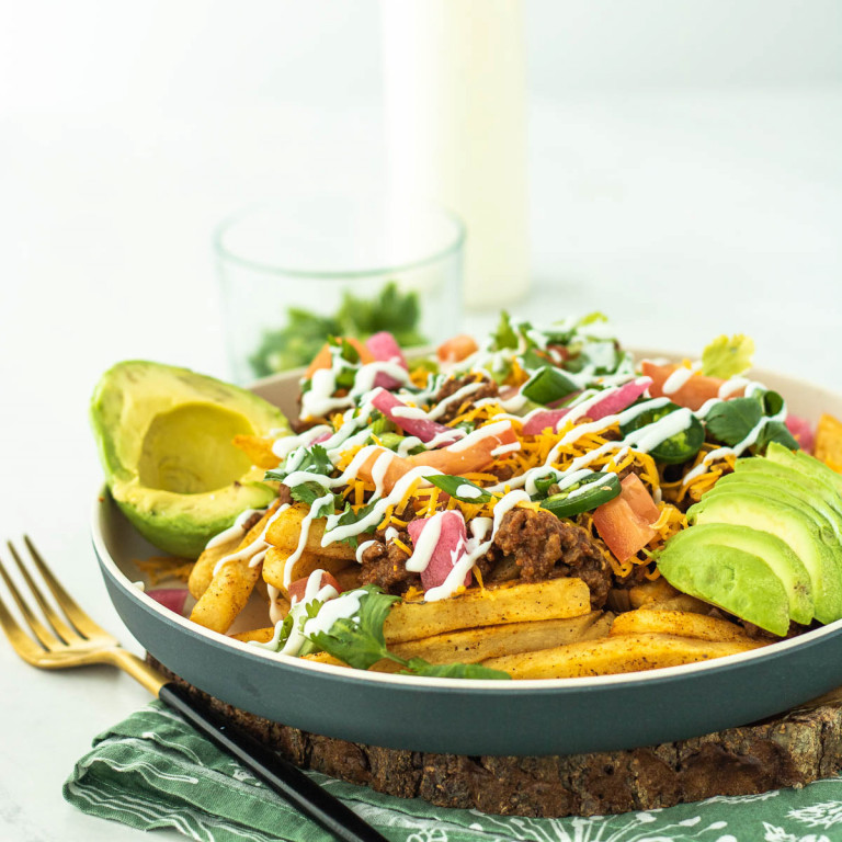 loaded taco fries on a plate.