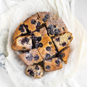 sliced blueberry cake with powdered sugar