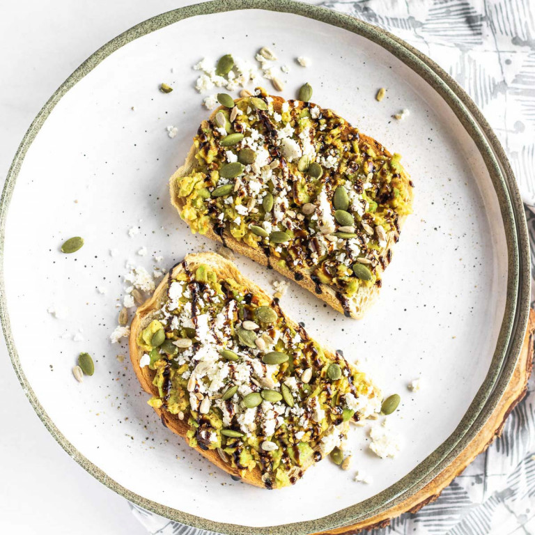 smashed avocado on toast on a plate