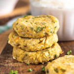 stacked chickpea patties on a wooden platter with a text overlay for Pinterest