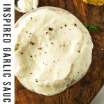 garlic dip in a bowl with text overlay for Pinterest