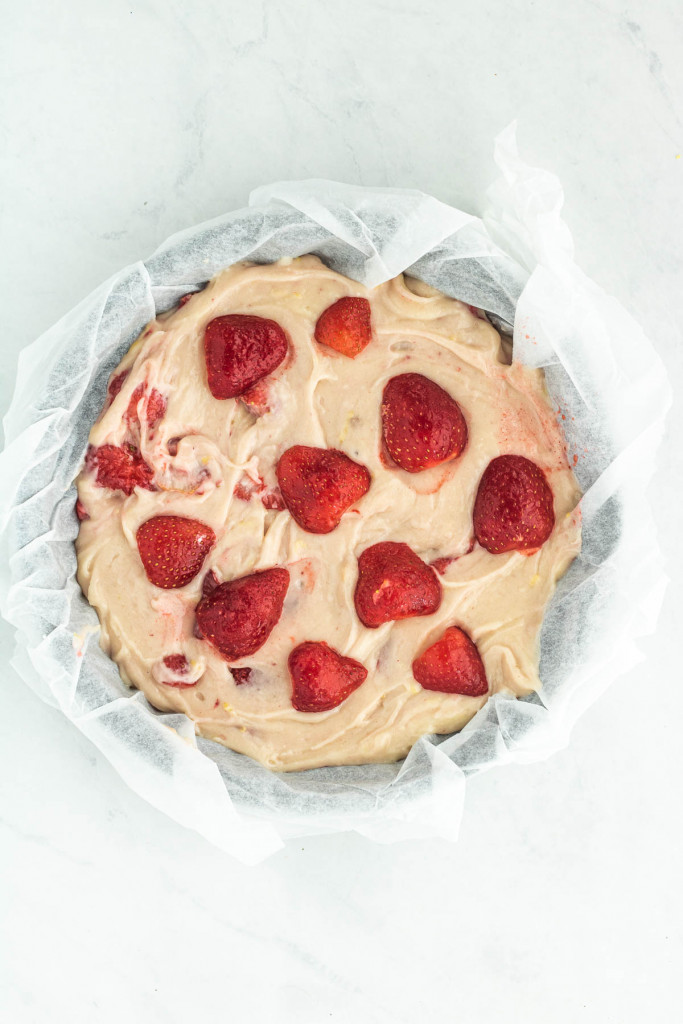 strawberries on top of the cake batter