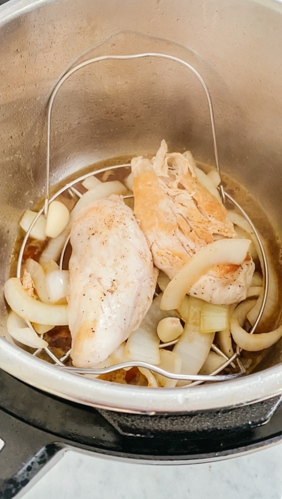 chicken and onions in the Instant Pot insert