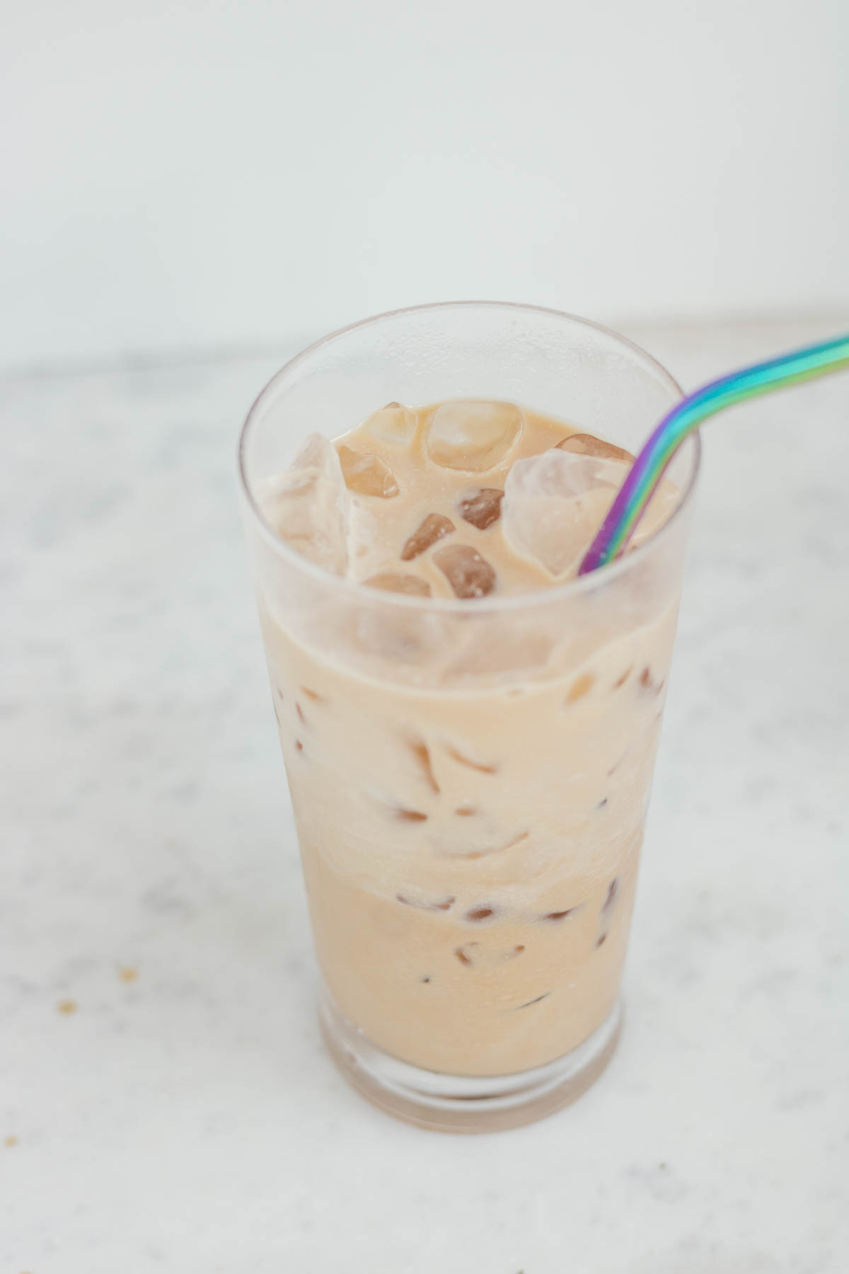 iced coffee in a glass with a straw
