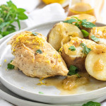 cooked chicken and potatoes on a plate with a text overlay for Pinterest