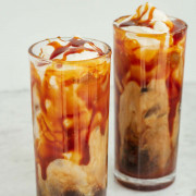 iced caramel latte with whipped cream and caramel sauce on top