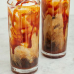 iced caramel latte with whipped cream and caramel sauce on top
