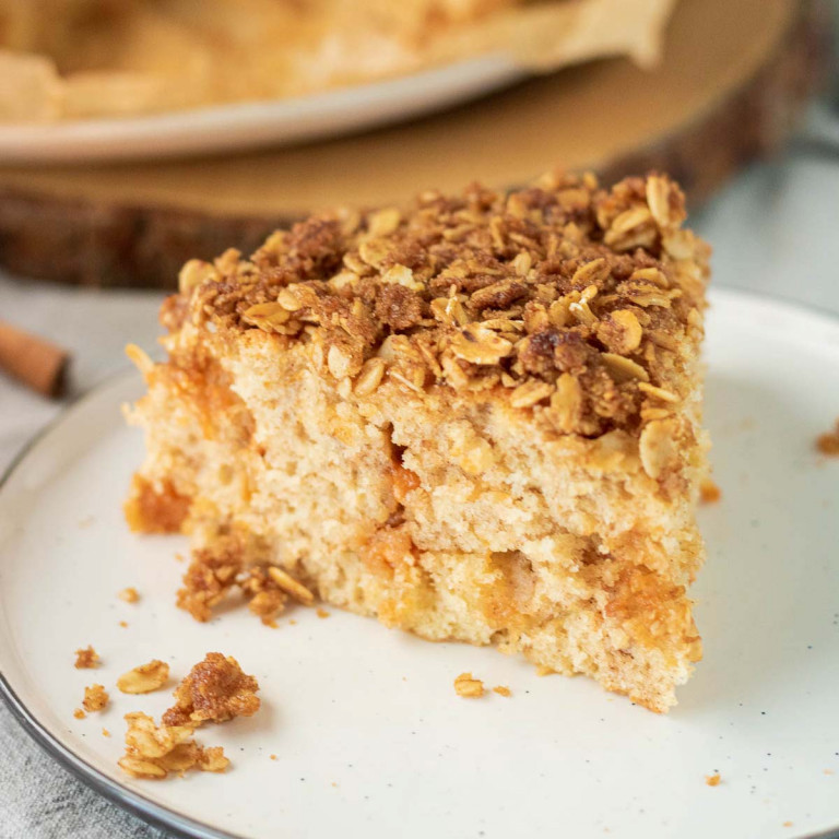 Slice of Cake with streusel topping on a plate