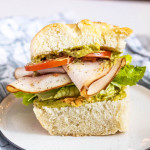 a turkey pesto sandwich on a plate