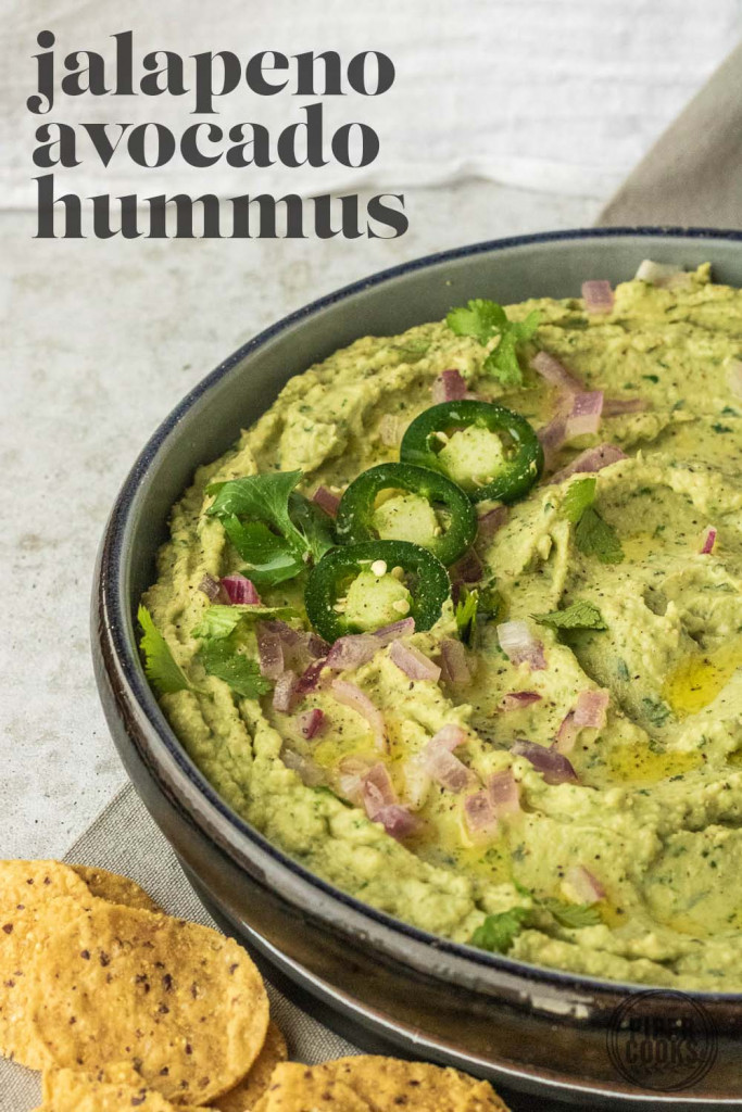Avocado hummus in a bowl with text title for pinterest.