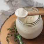 Lemon herb tahini sauce in a jar.
