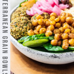 A mediterranean grain bowl with couscous, veggie balls and chickpeas in a bowl.