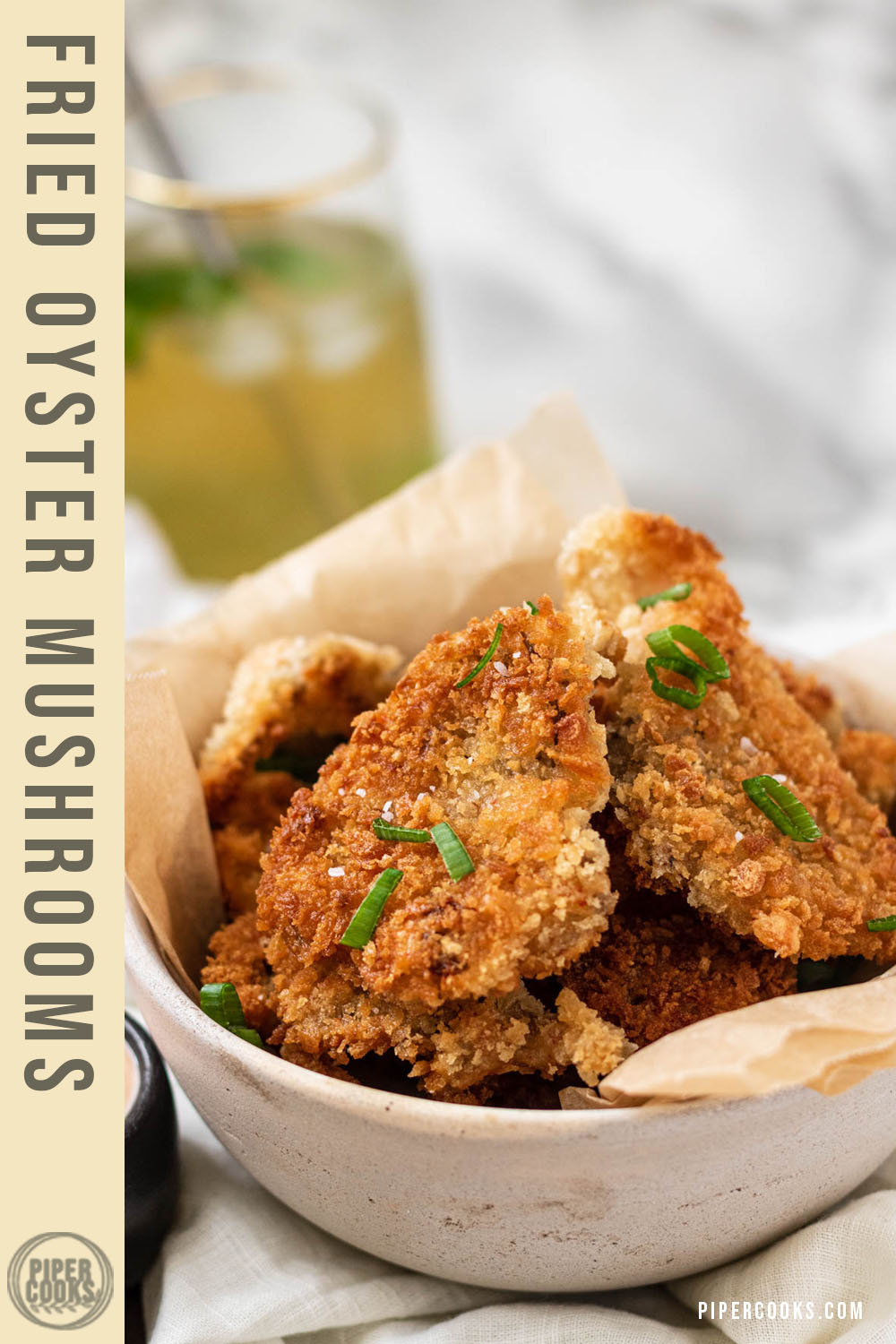 fried oyster mushrooms in a bowl with a text title overlay for Pinterest.