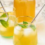 Iced Green Tea Lemonade in glasses with mint and a metal straw.