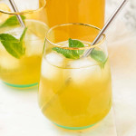 Iced Green Tea Lemonade in glasses with mint and a metal straw.