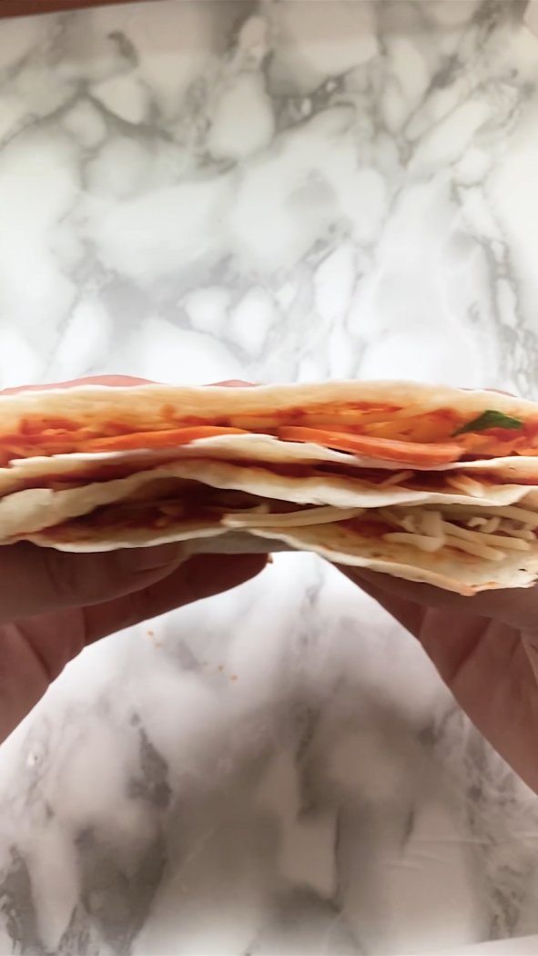 Cross section of a folded pizza quesadilla.