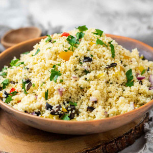 Couscous with chopped vegetables in a bowl.