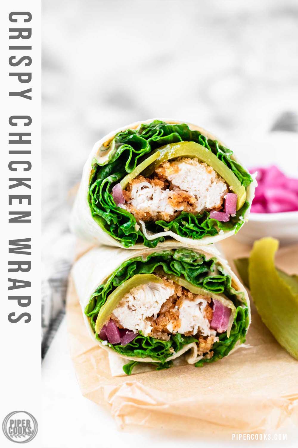The cut ends of two stacked wraps filling with lettuce, crispy chicken, and lettuce with a text title overlay.