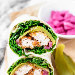 The cut ends of two stacked wraps filling with lettuce, crispy chicken, and lettuce with a text title overlay.