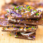 Pieces of chocolate bark stacked in a pile.