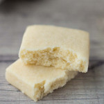 Scottish shortbread cookies, broken in half to show the texture inside.