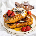 Stacked french toast sandwiches on a plate.