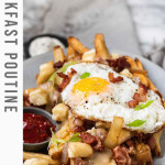 Fries topped with cheese curds, gravy, bacon, and an egg.