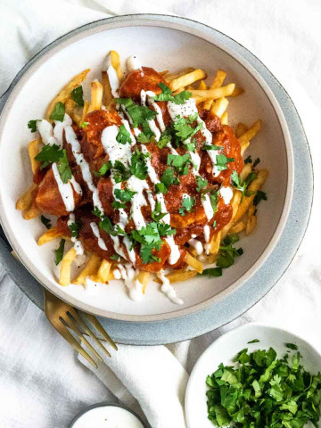 Fries with butter chicken sauce on top.