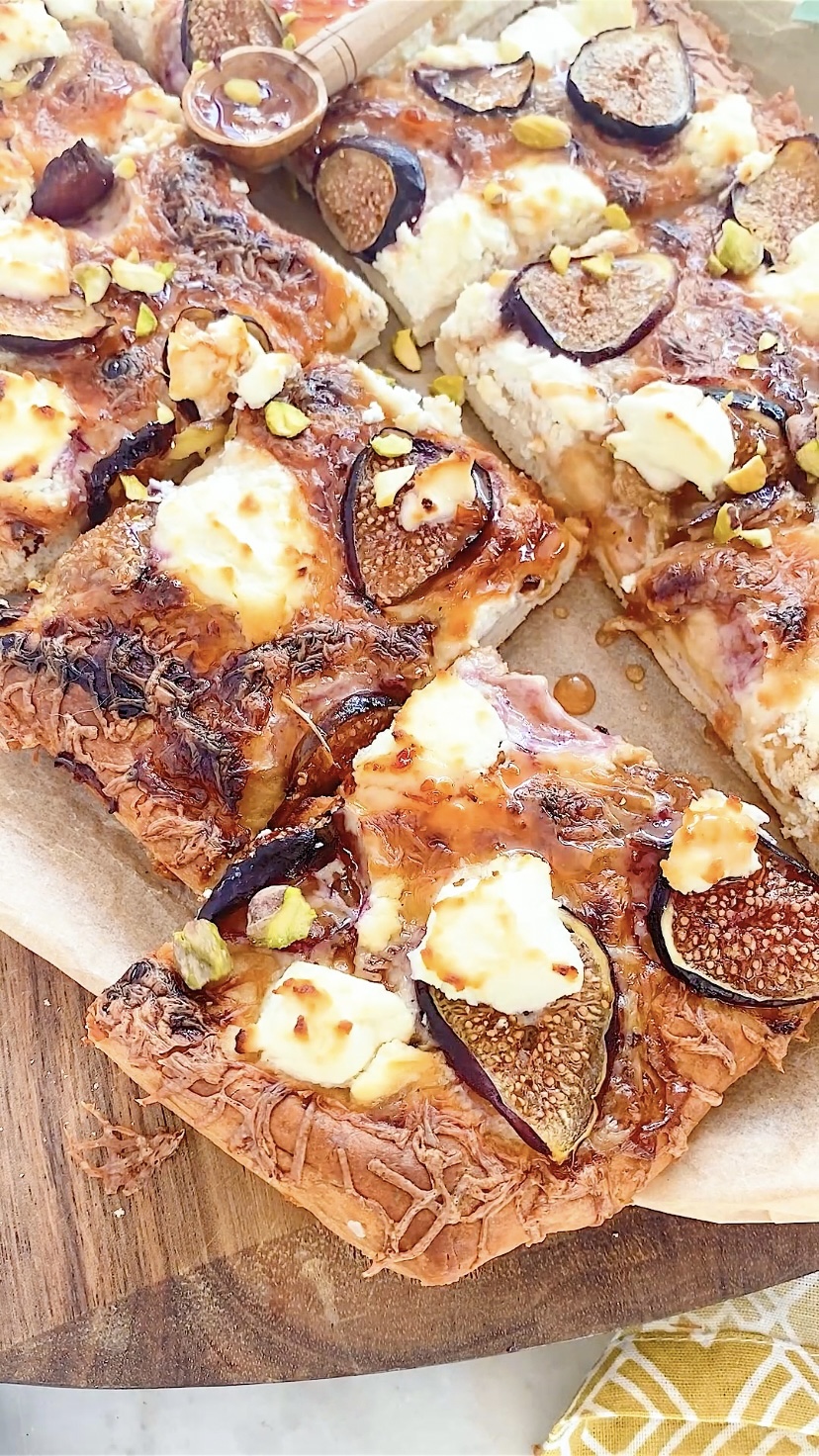A pizza with figs and goat cheese.