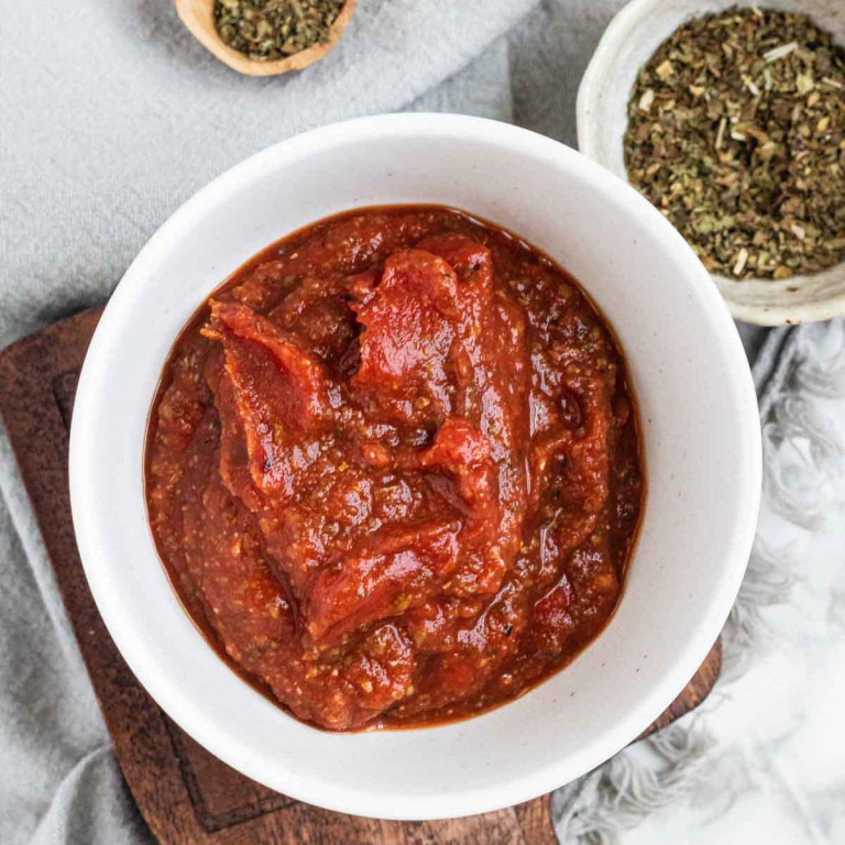 Pizza sauce in a bowl.