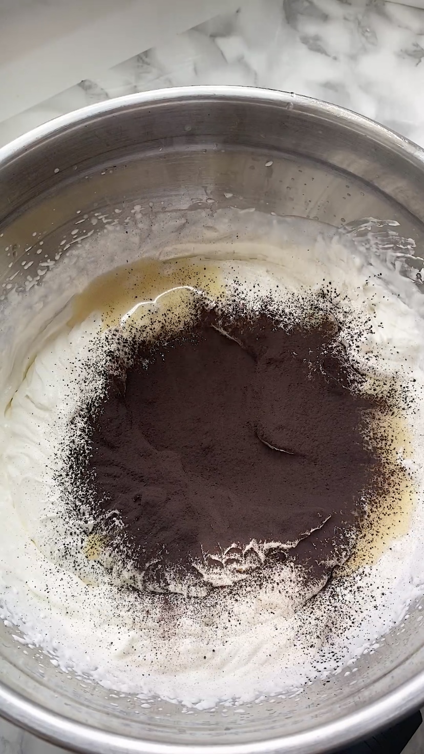 Cocoa powder on top of a no-churn ice cream base.