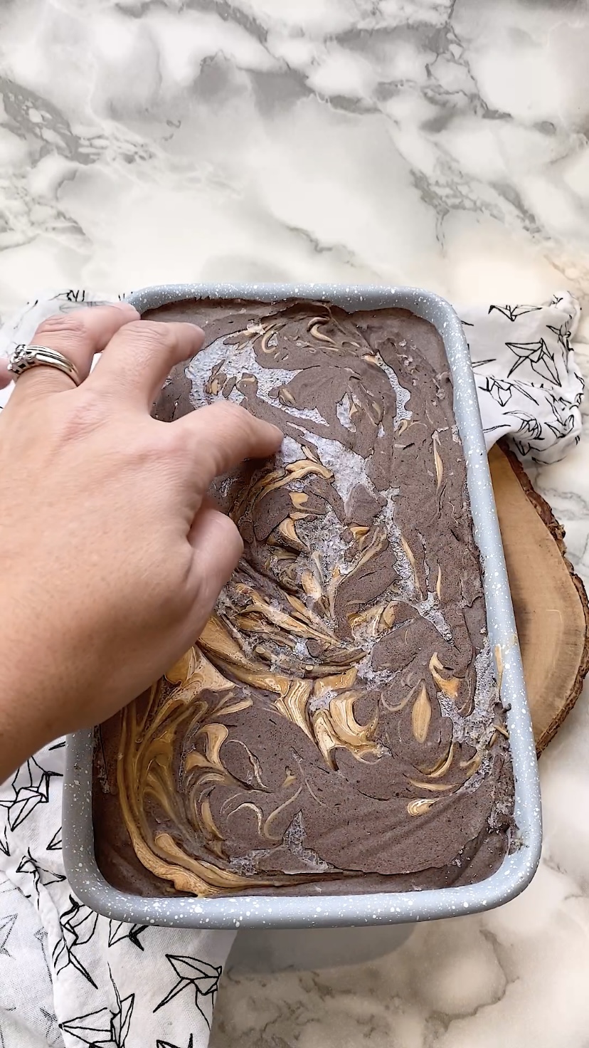 Chocolate peanut butter ice cream in a loaf pan.