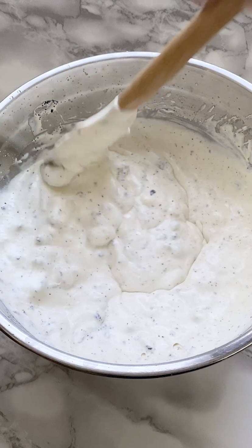 Folding cookies into whipped cream.
