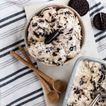 Oreo ice cream in a bowl with an oreo cookie on top.